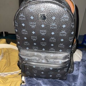 selling MCM backpack barely used , no rips/cracks in leather just a lil dusty